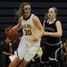 Saline High School senior Caitlin Ellis dribbles in the game against Woodhaven on Tuesday, March 5. Daniel Brenner I AnnArbor.com